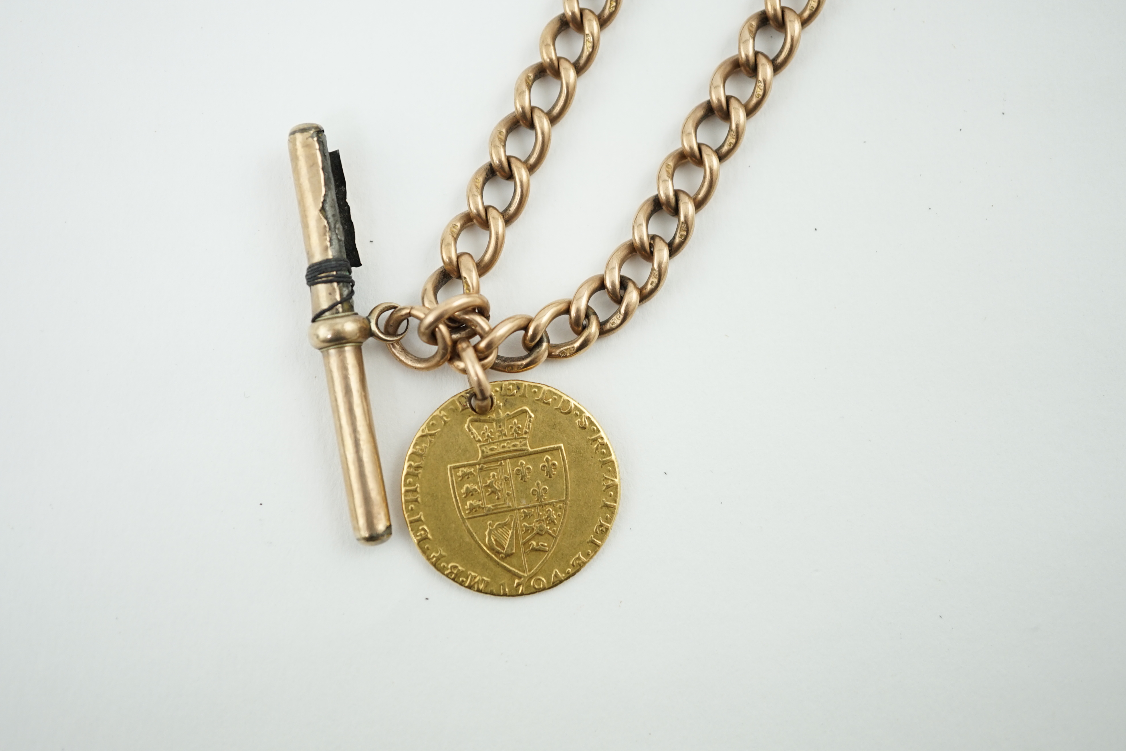 A 9ct gold albert, with gold plated T-bar and hung with a George III 1794 gold spade guinea